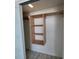 Interior of closet with custom shelving and sliding door for organized storage at 17408 Gulf Blvd # 201, Redington Shores, FL 33708