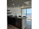 Modern kitchen features stainless steel appliances and a view of the ocean at 17408 Gulf Blvd # 201, Redington Shores, FL 33708