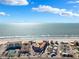 Breathtaking aerial view displaying the beach and ocean adjacent to the complex, emphasizing the prime coastal location at 17580 Gulf Blvd # 316, Redington Shores, FL 33708