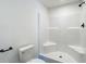 Bathroom featuring a toilet and standing shower at 18079 Carrolwood Dr, Brooksville, FL 34604