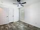 Bright bedroom features plank flooring, closet, fresh paint and natural light at 18079 Carrolwood Dr, Brooksville, FL 34604
