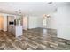 Open-concept home with living and kitchen area, featuring wood-look flooring at 18079 Carrolwood Dr, Brooksville, FL 34604
