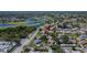 Aerial view of a peaceful neighborhood with tree-lined streets and nearby lakes at 1902 Dandridge St # 6, Sun City Center, FL 33573