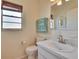 Neutral bathroom with tiled floor, sink and standard fixtures at 1902 Dandridge St # 6, Sun City Center, FL 33573