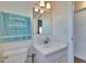 Bathroom featuring vanity with solid surface counters and a window at 1902 Dandridge St # 6, Sun City Center, FL 33573