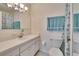 Bathroom featuring a blue seashell-themed shower curtain and a neutral vanity and toilet at 1902 Dandridge St # 6, Sun City Center, FL 33573