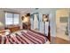 Bedroom with a four-poster bed with a bathroom located off the bedroom at 1902 Dandridge St # 6, Sun City Center, FL 33573