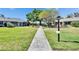 Picturesque community with paved walkways and lush green landscaping at 1902 Dandridge St # 6, Sun City Center, FL 33573