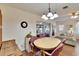 Cozy dining room with a round table, comfortable seating, and a view of the adjacent living area at 1902 Dandridge St # 6, Sun City Center, FL 33573