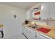 Kitchen featuring double sink, neutral cabinets, and wood countertops at 1902 Dandridge St # 6, Sun City Center, FL 33573