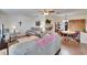 Cozy living room with comfortable seating, warm lighting, and an open layout leading to the dining area at 1902 Dandridge St # 6, Sun City Center, FL 33573