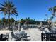 Relaxing community pool area with ample seating, umbrellas, and lush tropical landscaping at 1902 Dandridge St # 6, Sun City Center, FL 33573