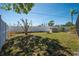 Spacious fenced backyard features a shed and well-maintained landscaping at 1996 Promenade Way, Clearwater, FL 33760