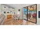 Bright dining area adjacent to the lanai has a glass sliding door and views of the outdoors at 1996 Promenade Way, Clearwater, FL 33760