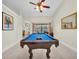 Spacious game room with a pool table and ample natural light offers space for relaxation and entertainment at 1996 Promenade Way, Clearwater, FL 33760