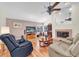 Comfortable living room boasts a fireplace, TV, and ample seating at 1996 Promenade Way, Clearwater, FL 33760