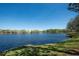 Lakeside view showcasing the calm waters and the residences across the way at 1996 Promenade Way, Clearwater, FL 33760