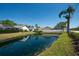 Enjoy pond views from the backyard of this lovely home with beautiful landscaping at 1996 Promenade Way, Clearwater, FL 33760