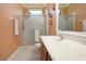 Well-lit bathroom featuring a glass shower enclosure, modern vanity, and a neutral color scheme at 221 Shell Falls Dr, Apollo Beach, FL 33572