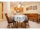 Dining area with seating for four, open to the kitchen and buffet table at 221 Shell Falls Dr, Apollo Beach, FL 33572