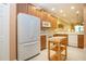 Spacious kitchen with wooden cabinets, white appliances, and a butcher block island at 221 Shell Falls Dr, Apollo Beach, FL 33572