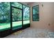 Screened-in lanai providing a view of the outdoors, perfect for relaxation and enjoying the landscape at 221 Shell Falls Dr, Apollo Beach, FL 33572