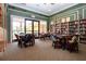 Reading room with comfortable seating, bookshelves, tables for games, and plenty of natural light at 221 Shell Falls Dr, Apollo Beach, FL 33572