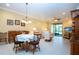 Bright living room with a ceiling fan, slider door, media center and a dining area at 221 Shell Falls Dr, Apollo Beach, FL 33572