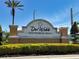Entrance sign for Del Webb Southshore Falls, a gated community with lush landscaping at 221 Shell Falls Dr, Apollo Beach, FL 33572