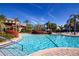 Sparkling swimming pool with lush landscaping and nearby lounge seating for relaxation at 221 Shell Falls Dr, Apollo Beach, FL 33572