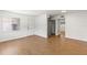 Bright living room with hardwood flooring, closet, and natural light at 250 Nw Rosery Rd # 314, Largo, FL 33770