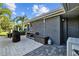 Outdoor kitchen with sink, storage, and grill, seamlessly integrated into the backyard design for al fresco dining and entertaining at 2674 Fairway S Ave, St Petersburg, FL 33712