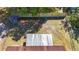 Aerial view of a large backyard with new fence, storage shed, and patio at 2721 Stratford Dr, Sarasota, FL 34232