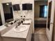 Bathroom featuring double sinks and a view into bedroom area at 3267 Pleasant Willow Ct, Brandon, FL 33511