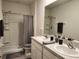 Bathroom featuring double sinks, shower and toilet at 3267 Pleasant Willow Ct, Brandon, FL 33511