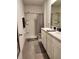 Bathroom featuring double sinks, shower and toilet at 3267 Pleasant Willow Ct, Brandon, FL 33511
