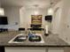 Dining space with an eat in bar looking into a modern kitchen with stainless appliances and pendant lights at 3267 Pleasant Willow Ct, Brandon, FL 33511
