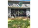 Home exterior featuring a screened lanai with access to a spacious backyard and AC unit at 3267 Pleasant Willow Ct, Brandon, FL 33511