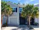 Charming townhome featuring a well-maintained front yard with mature palm trees and a single car garage at 3267 Pleasant Willow Ct, Brandon, FL 33511