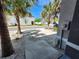 View of the front entrance with a sidewalk, palm trees, and view of neighboring buildings across the street at 3267 Pleasant Willow Ct, Brandon, FL 33511