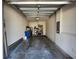 Open garage space with overhead storage, lighting, and ample room for parking at 3267 Pleasant Willow Ct, Brandon, FL 33511
