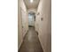 Hallway featuring tile flooring and access to various rooms in the home at 3267 Pleasant Willow Ct, Brandon, FL 33511