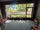 Screened lanai with view of the fenced backyard and green lawn at 3267 Pleasant Willow Ct, Brandon, FL 33511