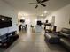Open-concept living area showcasing modern decor, bright lighting, and seamless flow to the kitchen at 3267 Pleasant Willow Ct, Brandon, FL 33511