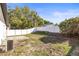 Good-sized backyard with a white vinyl fence and an AC unit at 3318 Peterborough Pl, Palm Harbor, FL 34684