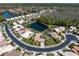 Community aerial view featuring beautiful homes surrounding a scenic pond and lush greenery at 3639 Darston St, Palm Harbor, FL 34685