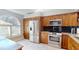 Stylish kitchen featuring stainless steel appliances and light tile floors at 3639 Darston St, Palm Harbor, FL 34685