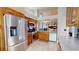 Open kitchen layout with updated appliances and view into the living area at 3639 Darston St, Palm Harbor, FL 34685