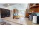 Modern kitchen with black backsplash, stainless steel appliances, and bright countertops at 3639 Darston St, Palm Harbor, FL 34685