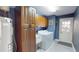 Laundry room with full size washer and dryer, plus plenty of storage at 3639 Darston St, Palm Harbor, FL 34685